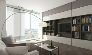 Nowoczesny salon z dużą biblioteczką i TV, idealny do przechowywania w małym mieszkaniu. Jasne wnętrze, wygodna sofa i panoramiczne okno.